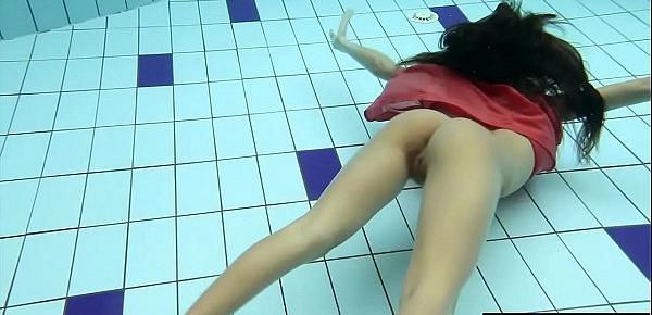  Sexy brunette Anna in red dress swimming